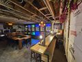 The Depths — full room with bar & D&D branding