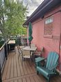 The Deck — riverside seating & umbrellas