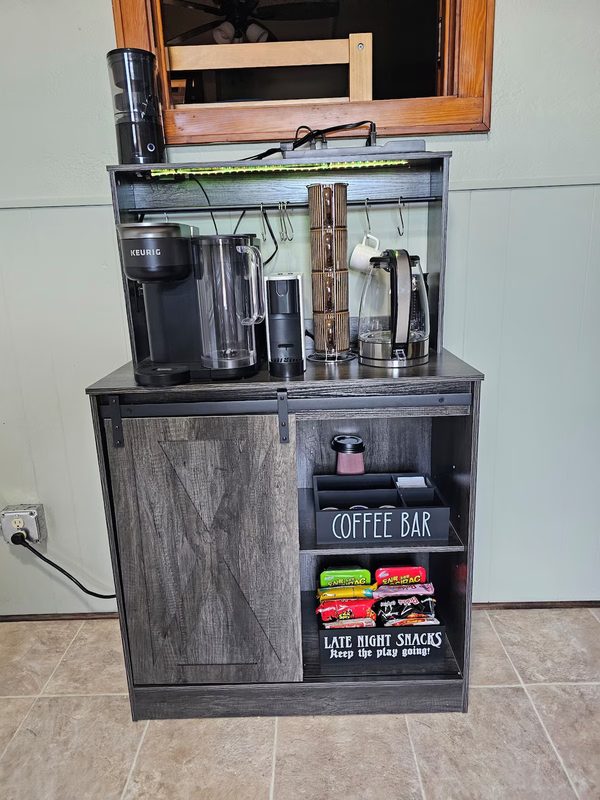 The coffee and instant noodle bar — Keurig, grinder, pods and a snack rail