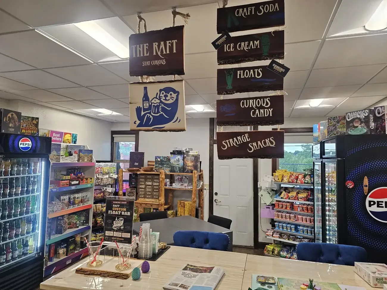 The Raft — hanging signs for craft soda, ice cream, floats, curious candy, and strange snacks
